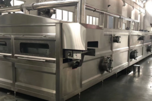 Continuous spray sterilization machine